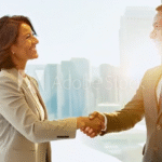 Happy couple shaking hands